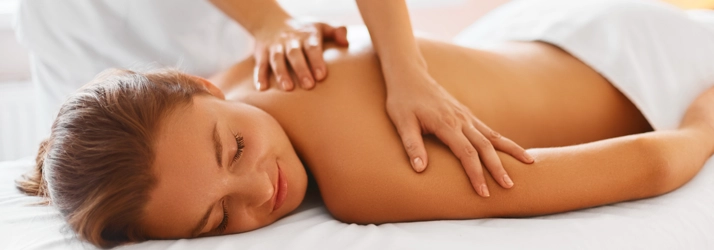 A person receiving a back massage.