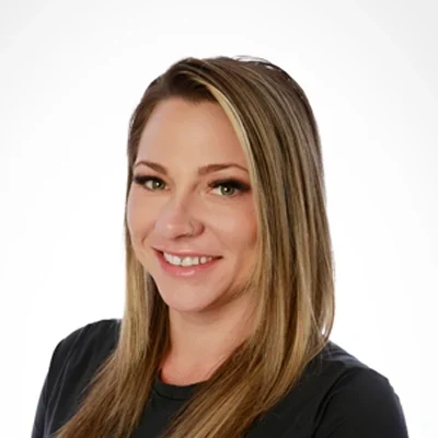 Nicole Pateliotes smiling in a black shirt.