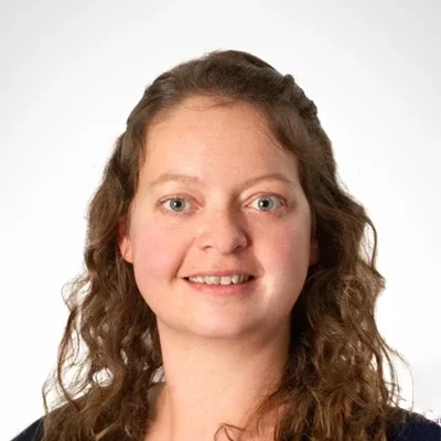 Ashley smiling in a black shirt.